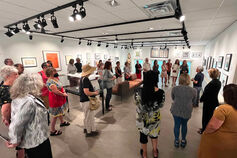 A group listens to a docent at the Dr. Caroline Beebe Gallery on the IU Bloomington campus.